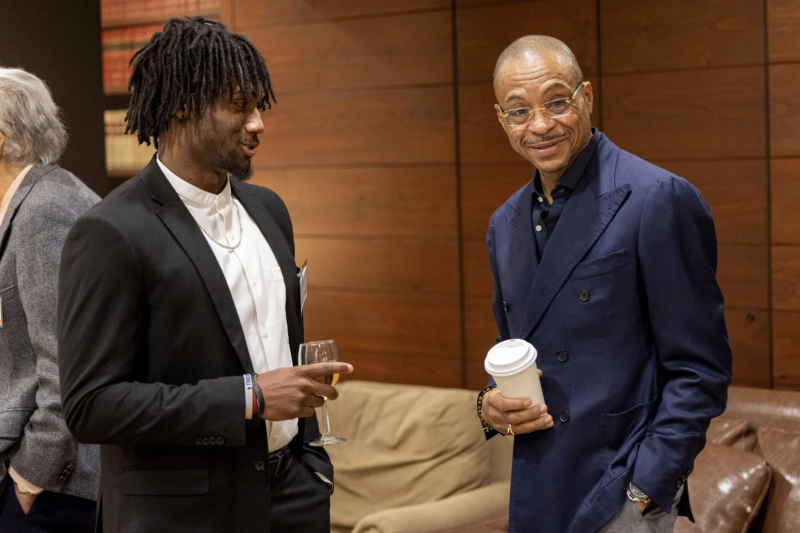 Kaleb Moody ’24 (left) talks with Gus Johnson, who returned to Dunster House to share his story with students