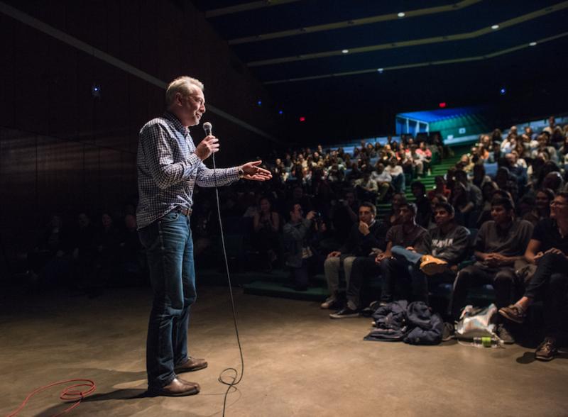 Faculty Member speaking to large student audience