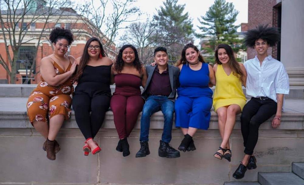 Maribel and friends sit on Widener Library's edge. 