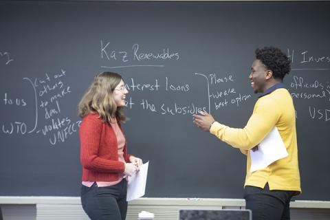 student and a teacher in a classroom
