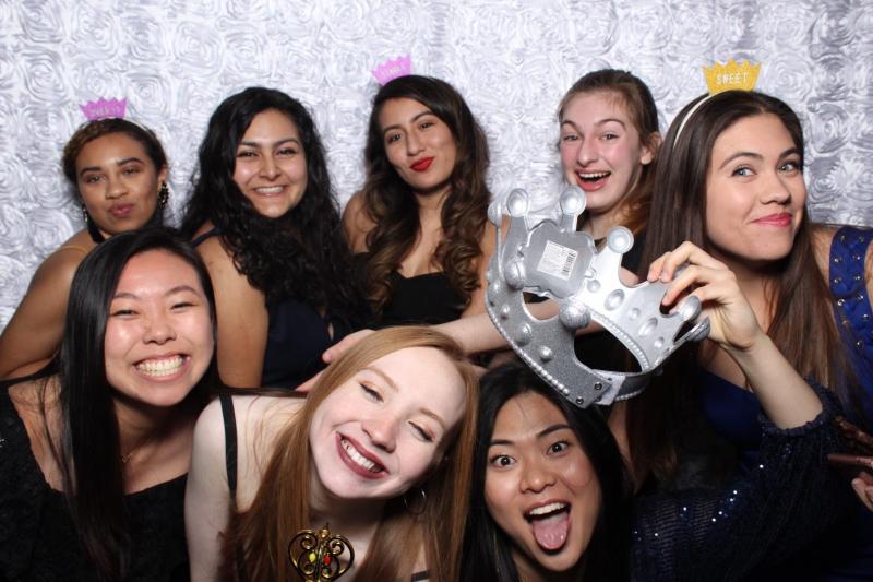 Maria posing with her friends at Quad formal.