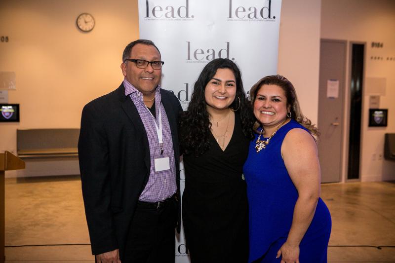 Maria posing with her parents at the LEAD 2019 Conference.